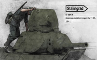 Stalingrad 3163 German soldier inspects T-34